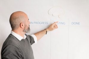 bearded-man-presenting-business-plan_23-2148513882