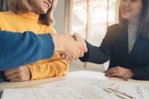 happy-young-asian-couple-realtor-agent_7861-1037