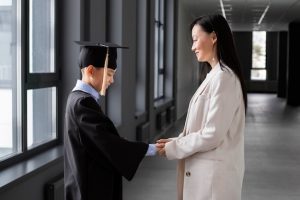 kid-celebrating-kindergarten-graduation-with-parent_23-2149371641