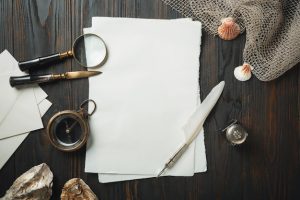 old-fashioned-flat-lay-with-letters-writing-accessories-dark-wooden-table_155003-3586