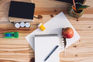 apple-feather-near-drawing-supplies_23-2147823772