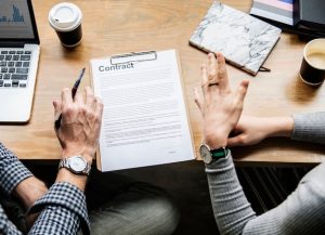 business-people-discussing-contract_53876-40333