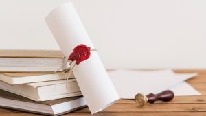 certificate-with-ribbon-bow-office-desk_23-2148769680-1