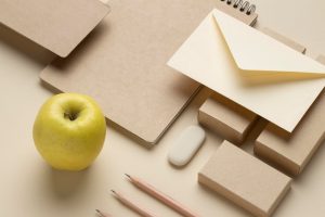 arrangement-with-stationery-elements-fruit_23-2148851529-2