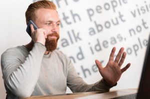 bearded-man-talking-phone_23-2148728885
