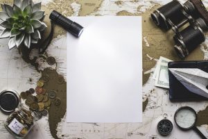 blank-paper-with-flashlight-travel-objects_23-2147604710-1