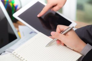 business-people-comparing-results-tablet_1232-1180