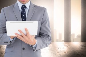 elegant-businessman-working-with-tablet_1134-580