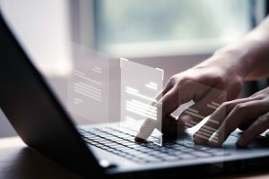 hand-using-laptop-computer-with-virtual-screen-document-online-approve-paperless-quality-assurance-erp-management-concept_616485-61-7
