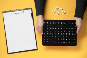 hands-holding-braille-alphabet-board_23-2148718171-2
