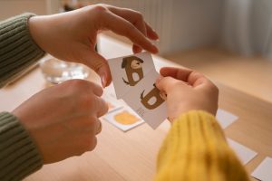 high-angle-kid-playing-memory-game_23-2150294741