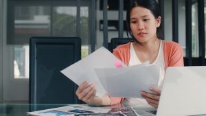 young-asian-pregnant-woman-records-income-expenses-home-mom-girl-happy-using-laptop-record-budget-tax-financial-document-e-commerce-working-living-room-home_7861-2185-2